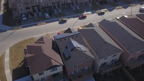 Rooftop solar panels in suburb from drone Stock Footage 105207566