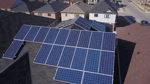 Rooftop solar panels in suburb from drone 스톡 동영상 105207595
