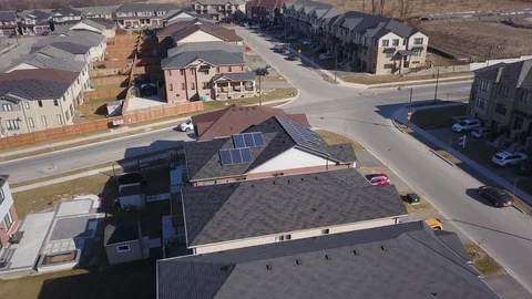 Rooftop solar panels in suburb from drone Stock Footage 105207616