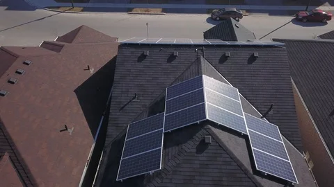 Rooftop solar panels in suburb from drone Stock Footage 105207617
