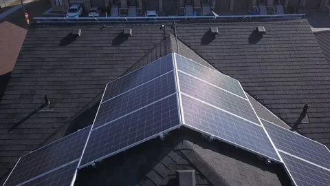 Rooftop solar panels in suburb from drone Stock Footage 105207644