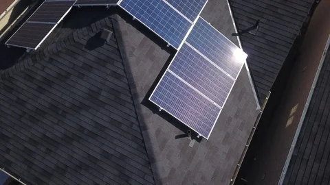 Rooftop solar panels in suburb from drone Stock Footage 105207678