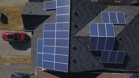 Rooftop solar panels in suburb from drone Stock Footage 105207693