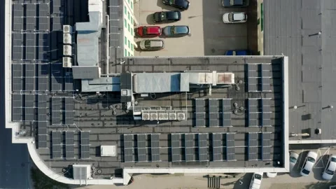 Rooftop Solar Technology Harnessing Sunlight In Smart Eco City Viewed From Drone Video stock 314114279