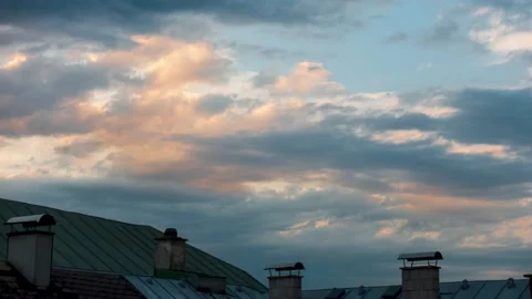 Rooftop Sunset Reflected off of Clouds Stock Footage 138997420