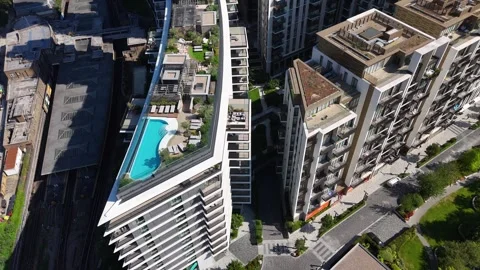 Rooftop swimming pool and sun terrace on a new residential tower, with a Stock Footage 343472172