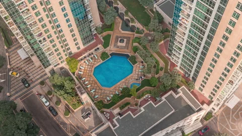 Rooftop swimming pool daytime timelapse Downtown Dubai geometric blue pool Stock Footage 337945567