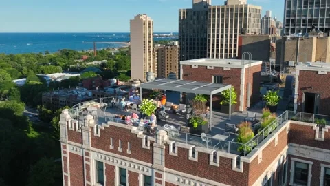 Rooftop terrace on skyscraper in Chicago with a view of Lake Michigan and Stock Footage 250526847