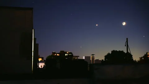 Rooftop Time-Lapse: Starry Sky, Moon &amp; Planes Over City at Night Stock Footage 260101564