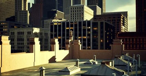 Rooftop view of city skyline with modern buildings at sunset Ilustración de archivo