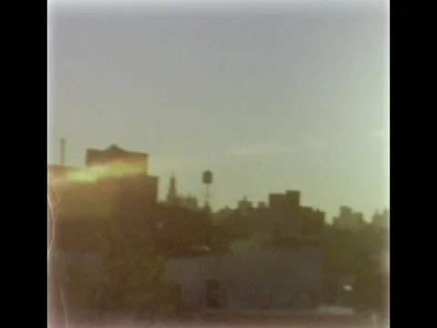 Rooftop view of Manhattan skyline at sunset. 8mm film footage. Stock Footage 75331000