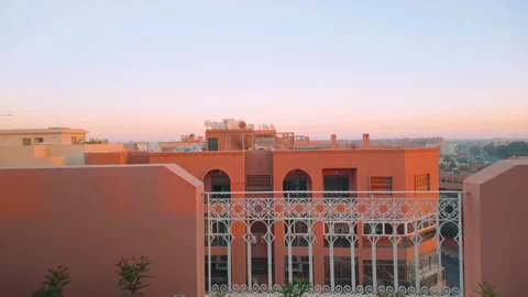 Rooftop View Of Marrakech At Sunset With Relaxing Lounge Chairs Video stock 302910001