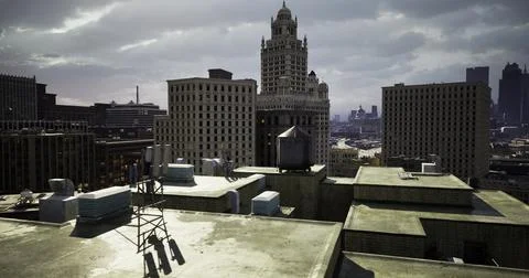 Rooftop view of urban architecture and skyline at sunset in city Stock Illustration