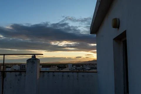Rooftop view watching sunset over urban cityscape Stock Photos
