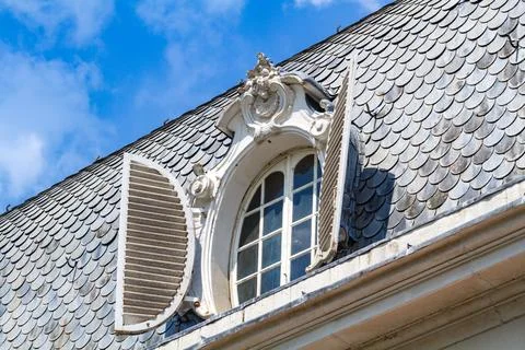 Rooftop Window with Open Shutters Stock Photos