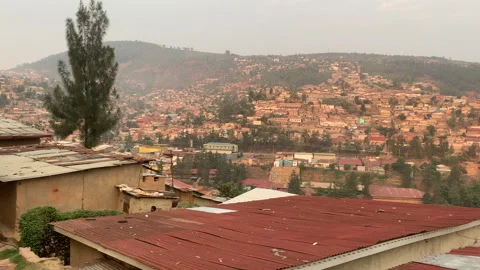 Rooftops and a hill in Rwanda Stock Footage 260668318