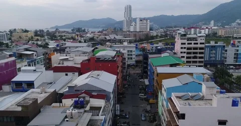 Rooftops and a narrow soi in a busy beach town Stock Footage 71300644