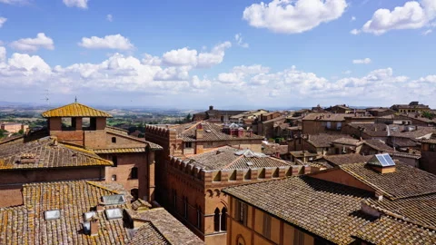 Rooftops and Open Countryside Under Bright Summer Skies in Tuscany Stock Footage 255798860