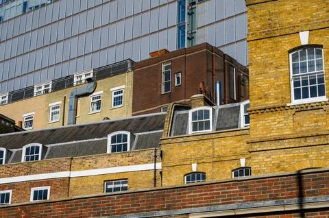 Rooftops and windows of brick buildings in London Stock Photos