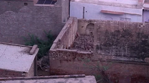 Rooftops in a busy town, inter-linked together. Shot in Govardhan, India. Pan an Stock Footage 51108879