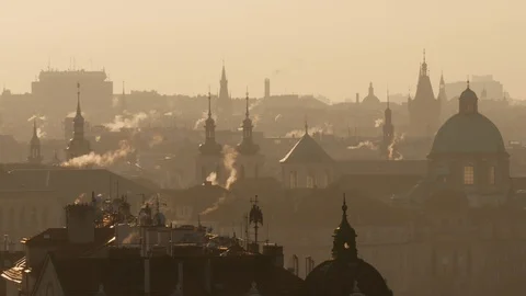 Rooftops of Prague during winter morning, smoke rising from chimneys Video stock 100288716
