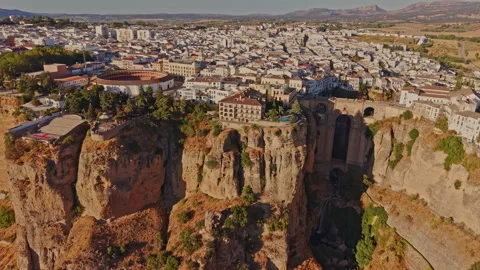 Rooftops of Ronda toward the dry fields of the Serrania Stock Footage 347759132