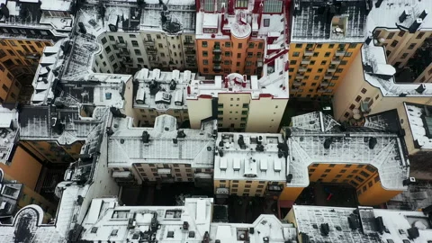 Rooftops snow covered in winter. Aerial drone shot of urban city buildings. Stock Footage 146012819