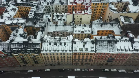 Rooftops snow covered in winter. Aerial drone shot of Stockholm city. Video stock 148420487