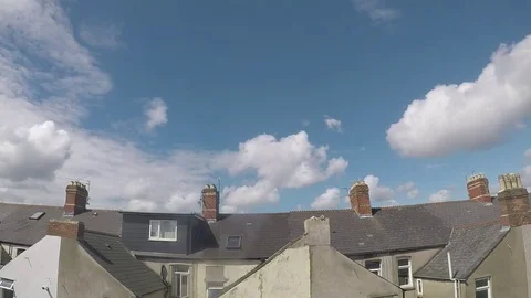 Rooftops timelapse on a sunny day with clouds rolling overhead Stock Footage
