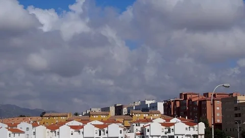 Rooftops with white heavy clouds over the city Stock Footage 84877750
