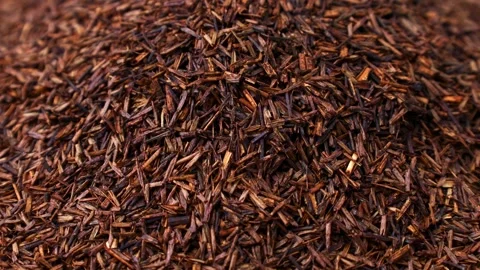 Rooibos tea dried leaves falling down close up 스톡 동영상 303915430