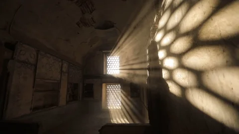 Room with a barred window, through which penetrate the light of the sun's rays Stock Footage 105300281