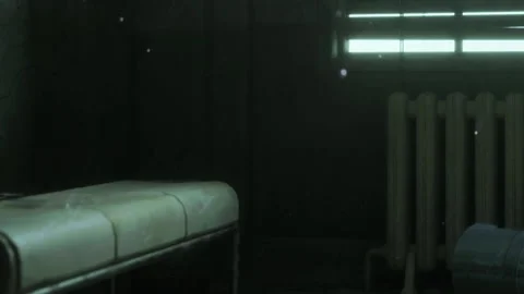 Room with a bed, wall, window, and radiator showing dust in the air Stock Footage 344408159