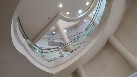 Room design inside, white ceiling, lamps, railings Stock Photos