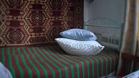 The room is dressed with old iron bed Vídeos de archivo 75858406