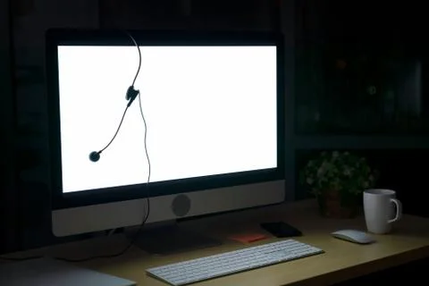 Room illuminated by a computer screen at night, no people,  Empty workplace p Stock Photos
