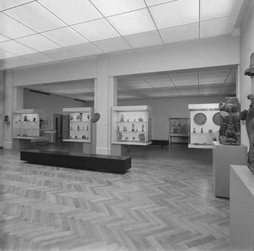 Room with images and small objects in showcases; Asian art, 1983. Room 12.... Stock Photos