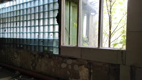 A room inside a building with broken windows and shabby walls. Stock Footage 219202197