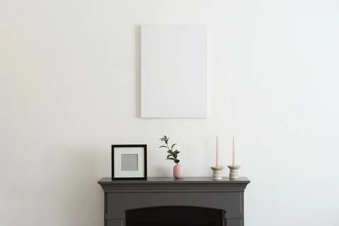 Room interior with fireplace, decorative elements and poster Stock Photos