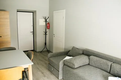 Room interior with minimalist design using natural wood headboard. Walls with Stock Photos