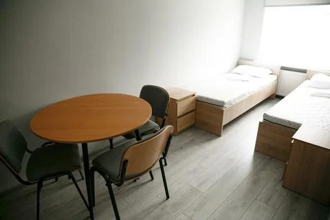 Room interior with minimalist design using natural wood headboard. Walls with Stock Photos