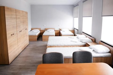 Room interior with minimalist design using natural wood headboard. Walls with Stock Photos
