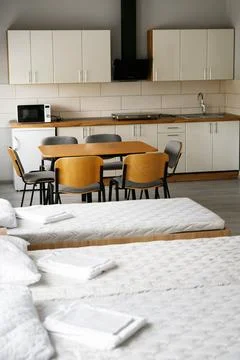 Room interior with minimalist design using natural wood headboard. Walls with Stock Photos