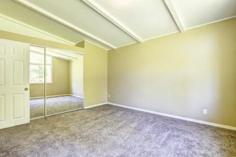 Room interior in soft ivory with mirror door closet Stock Photos