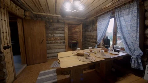 Room with large table, samovar, cups and food to replenish body fluids after Stock Footage 221939176