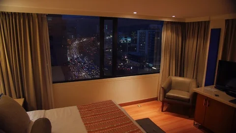 Room with night view and time lapse of busy street outside - Bogota, Colombia Vídeo Stock 104674915