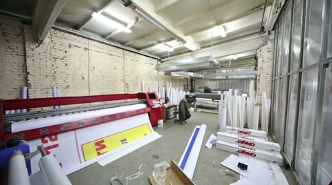 Room in printing house with large plotter and packages of paper Stock Footage 35236612