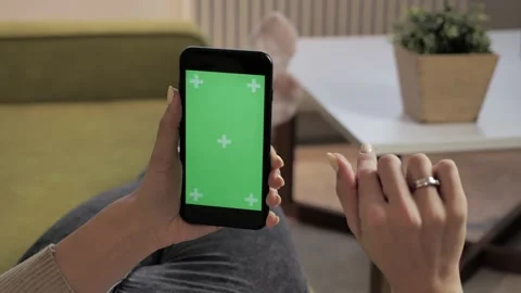 Room repose on a sofa Using Phone With Green Mock-up Screen Chroma Key. Stock Footage 141519518