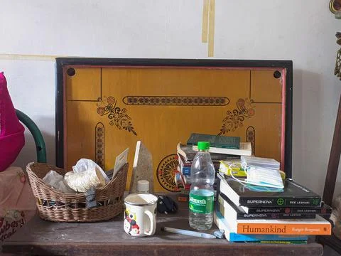 The room table was in a mess. The messy bed room with glasses, toys and books Stock Photos