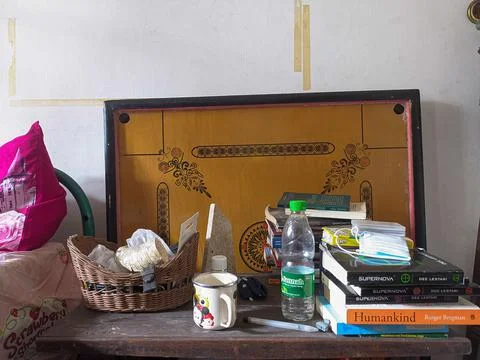 The room table was in a mess. The messy bed room with glasses, toys and books Stock Photos